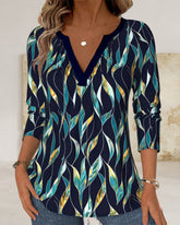 Luźna koszulka z nadrukiem liści i dekoltem w serek